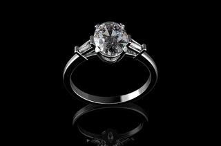 18k white gold custom made oval shape diamond engagement ring with tapered baguette side accent diamonds