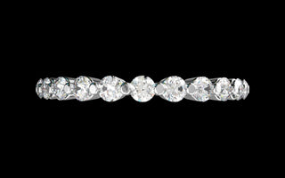 18k white gold floating diamond shared prong eternity band